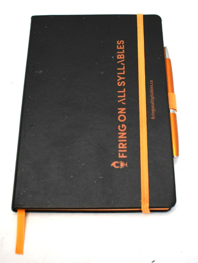 Black Hardcover Notebook with Pen Company Logo on Cover Firing On All Syllables