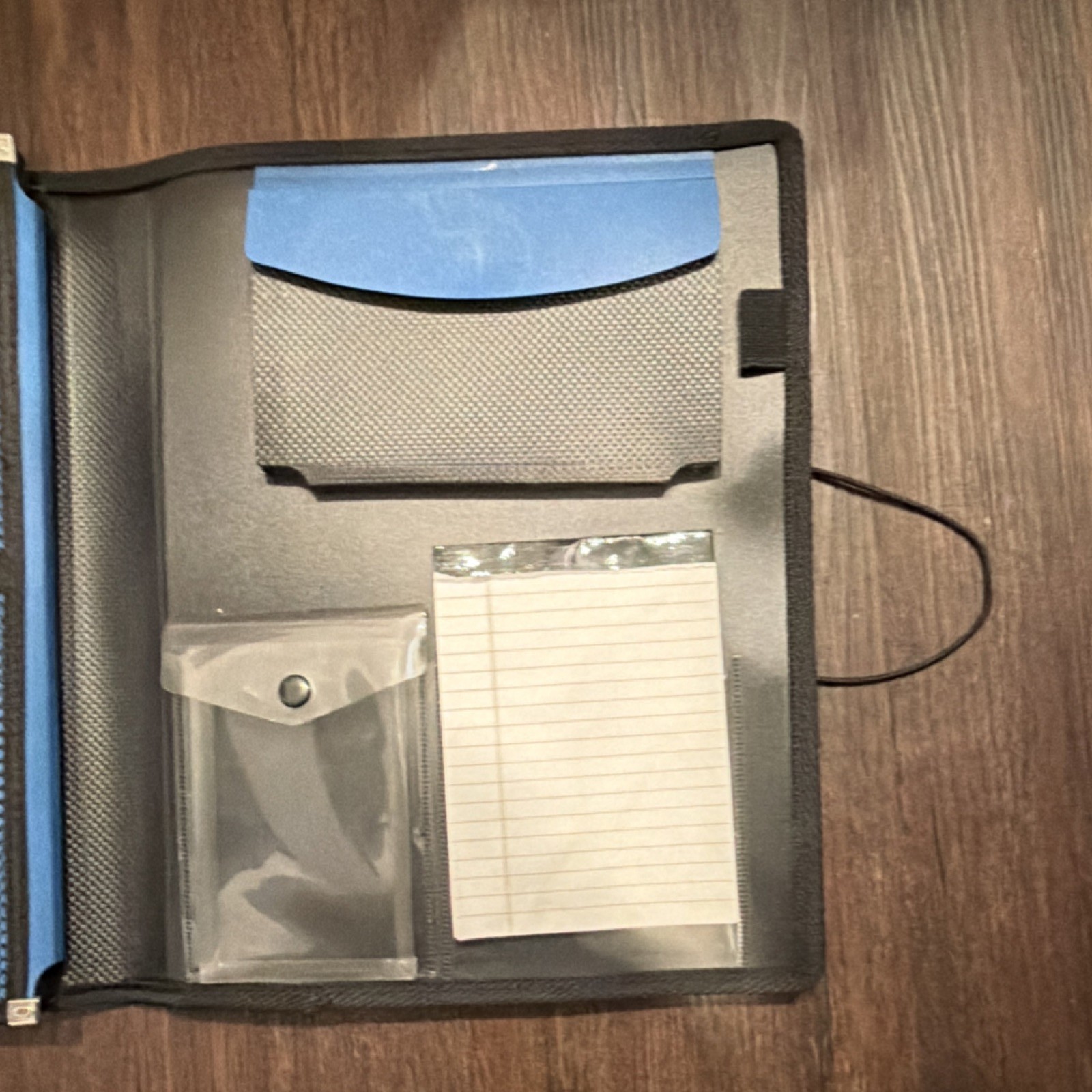 Blue and Black Organizer with Multiple Pockets and Notepad