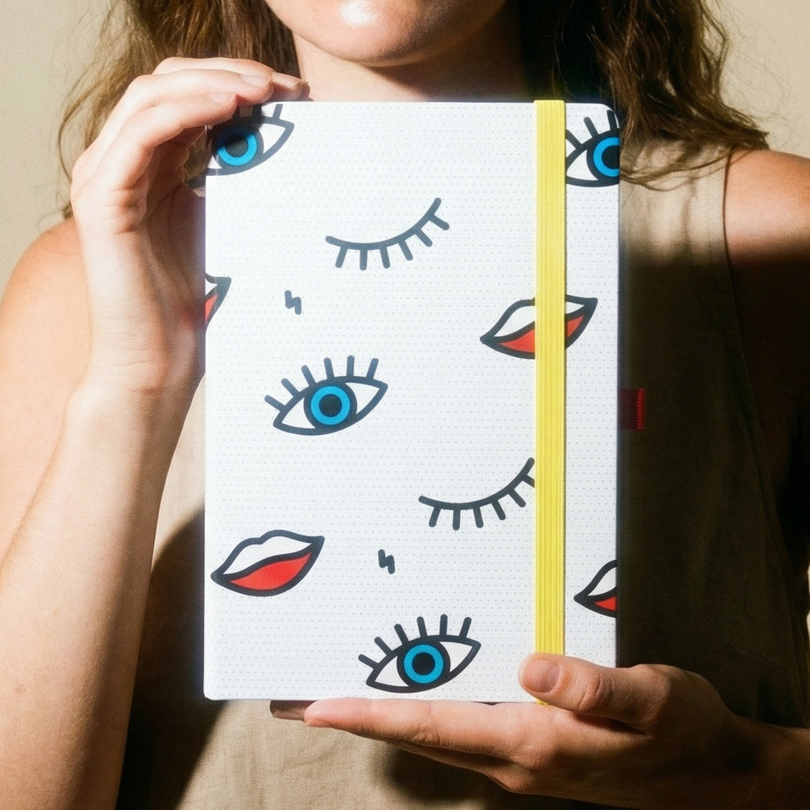 Mustard Wink Dot Grid Notebook | Eye and Lip Pop Art Print | Hardcover Strap A5