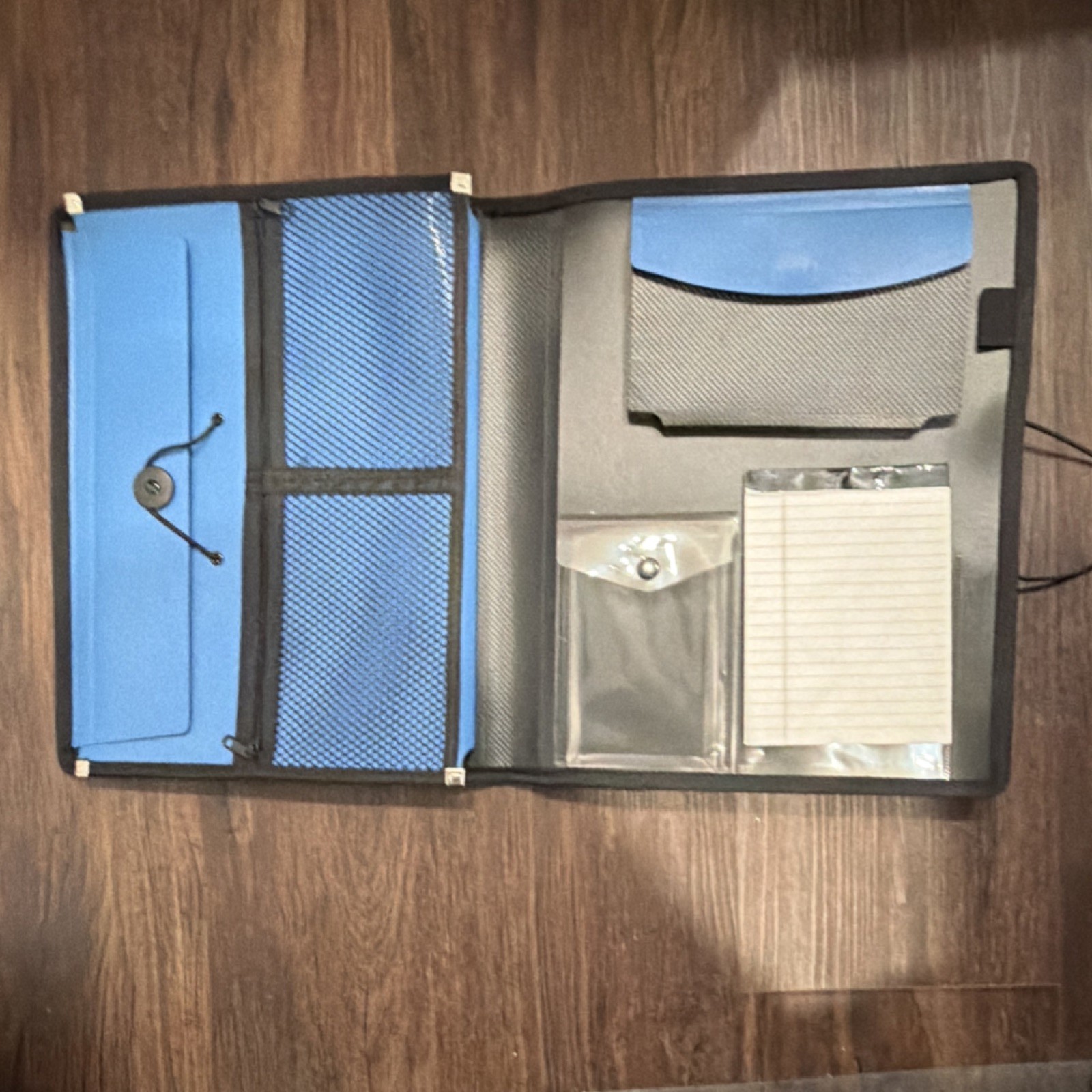 Blue and Black Organizer with Multiple Pockets and Notepad